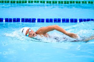 person swimming in body of water